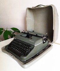 Green-olive Olympia SM2 a portable working vintage typewriter from the 1950S